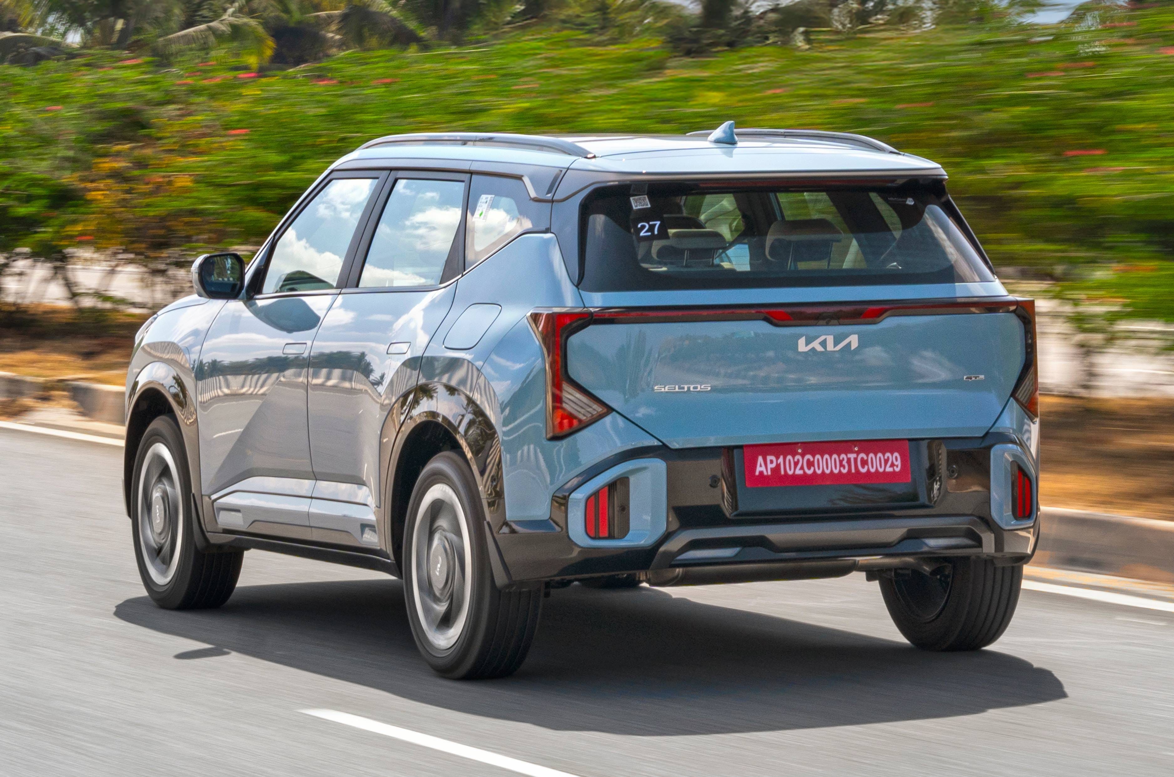 2026 Kia Seltos rear left side driving on road